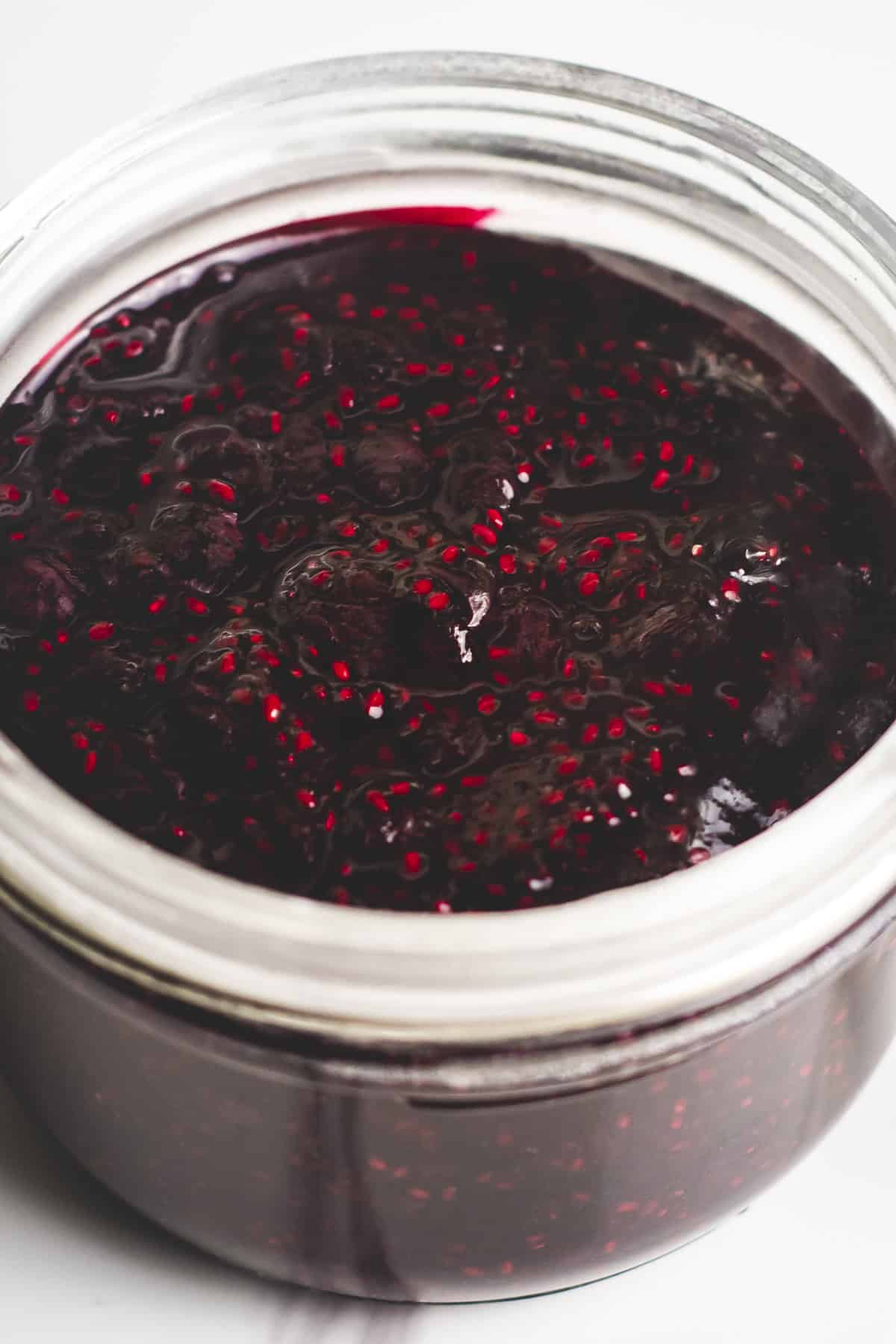 A jar of blueberry jam thickened with chia seeds.